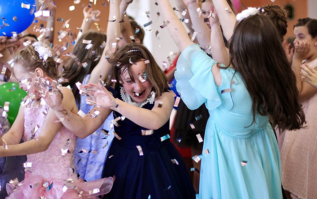 Kids celebrating at a school Valentine's Day dance