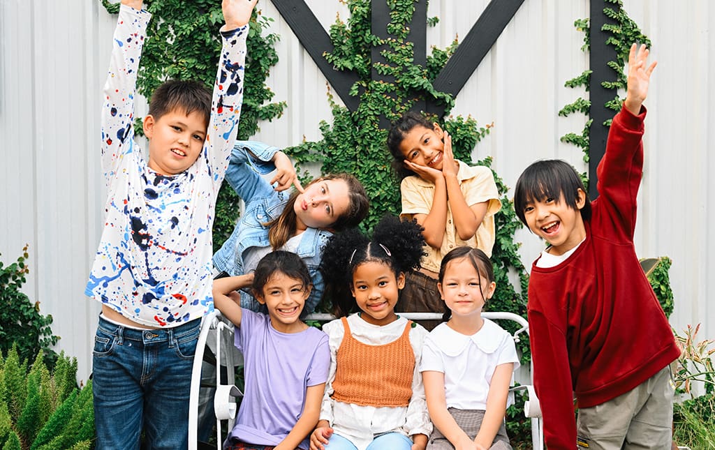 Cute kids sitting outside in early spring