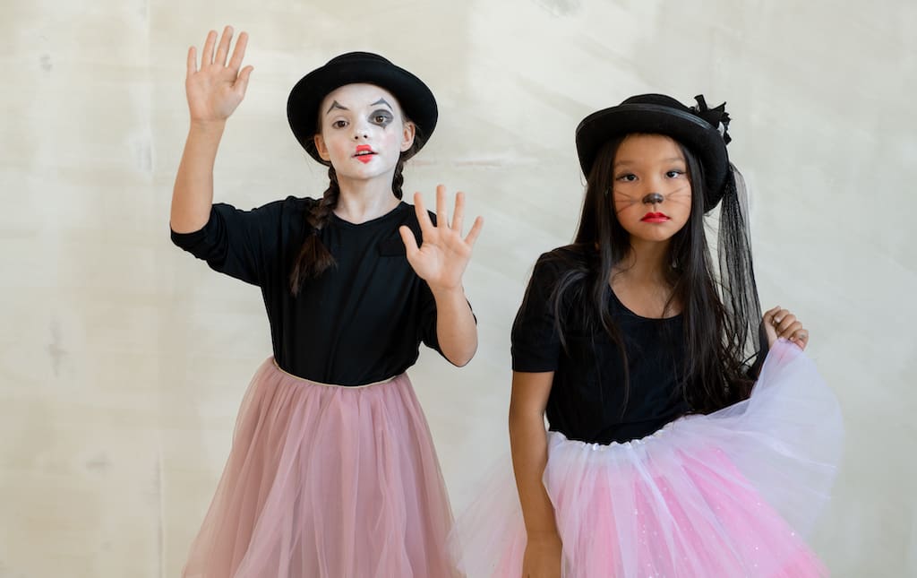 Two girls dancing during a Halloween-themed dance-a-thon