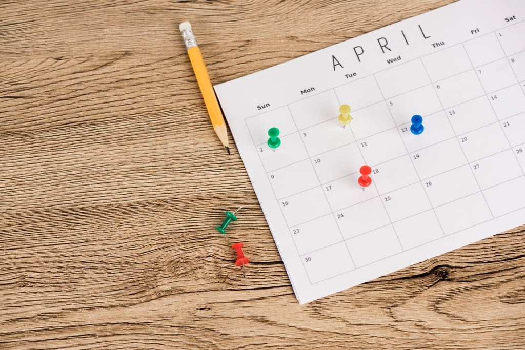 Calendar with pins in it to represent key mental health awareness dates