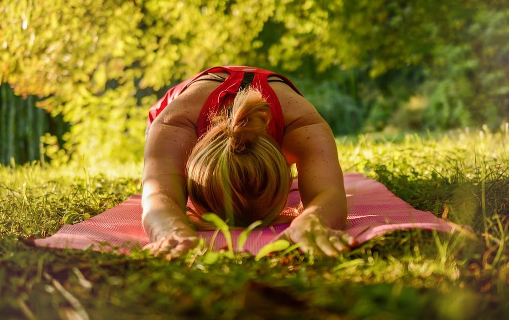 Young woman doing yoga outside