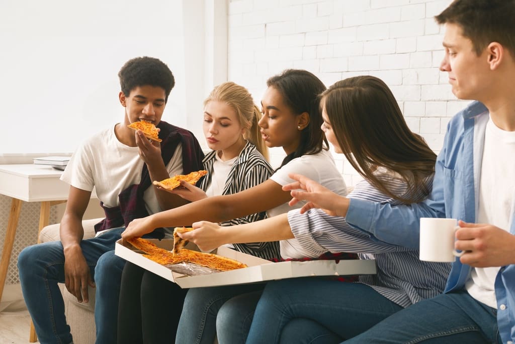 Students during pizza party reward for participating in group fundraiser