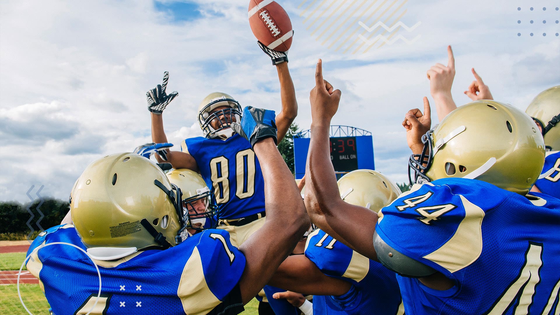 Highschool football players celebrating a touchdown