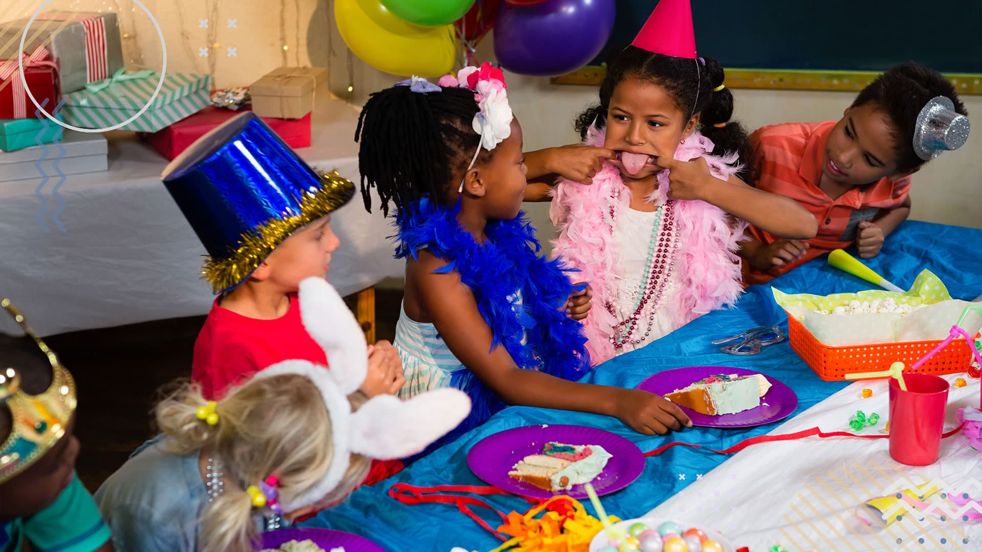 Group of children smiling and making funny faces at birthday party