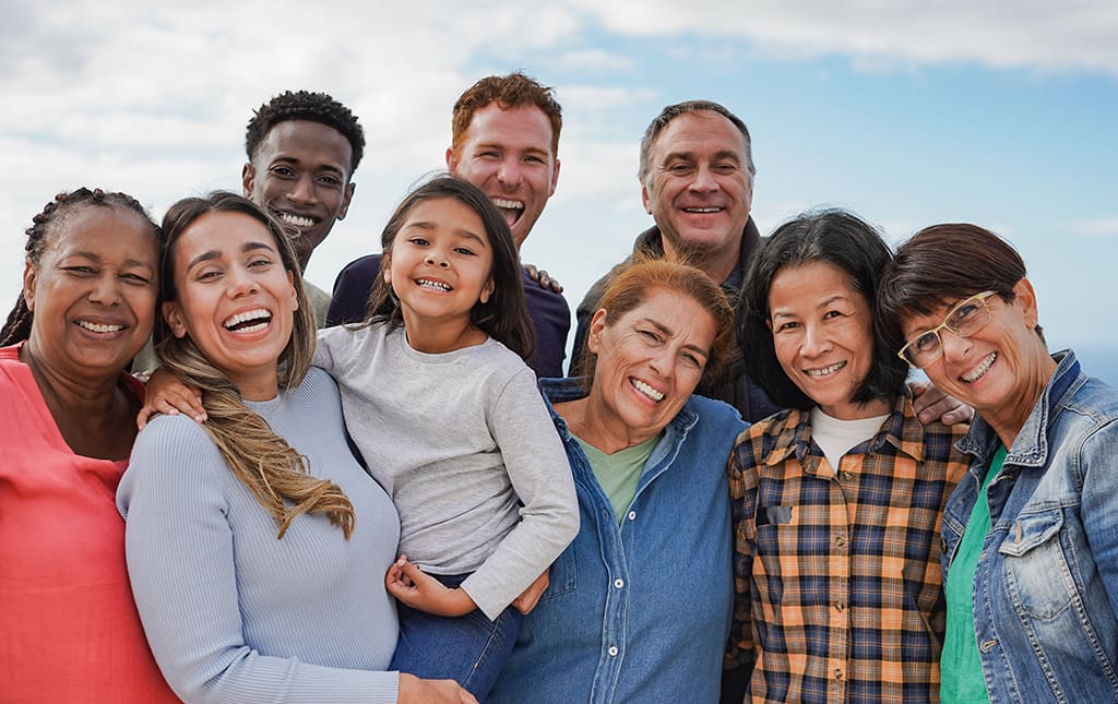 Group of multiracial people with different ages having fun together outdoor