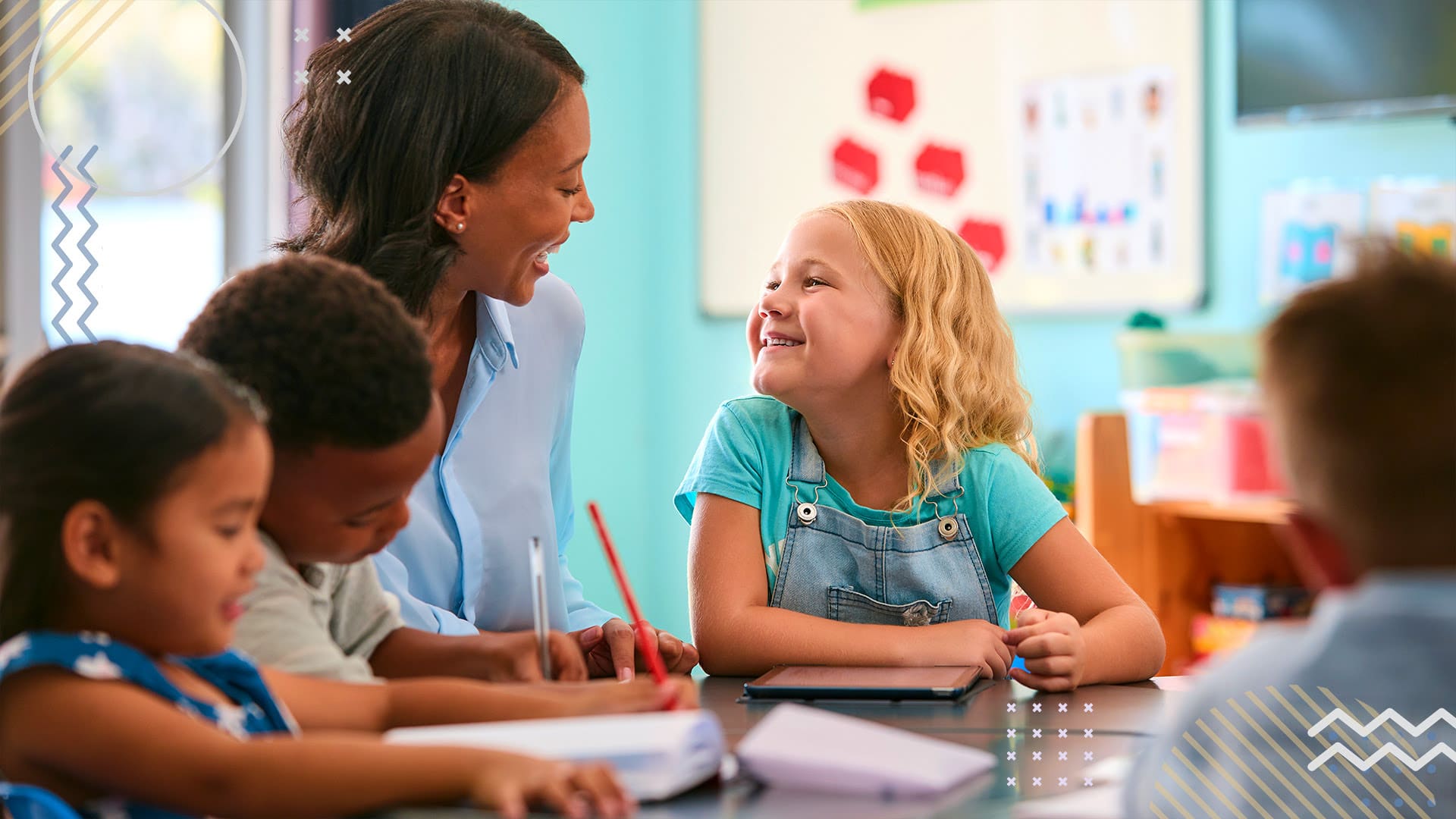 PTA Volunteer laughing and smiling with young student